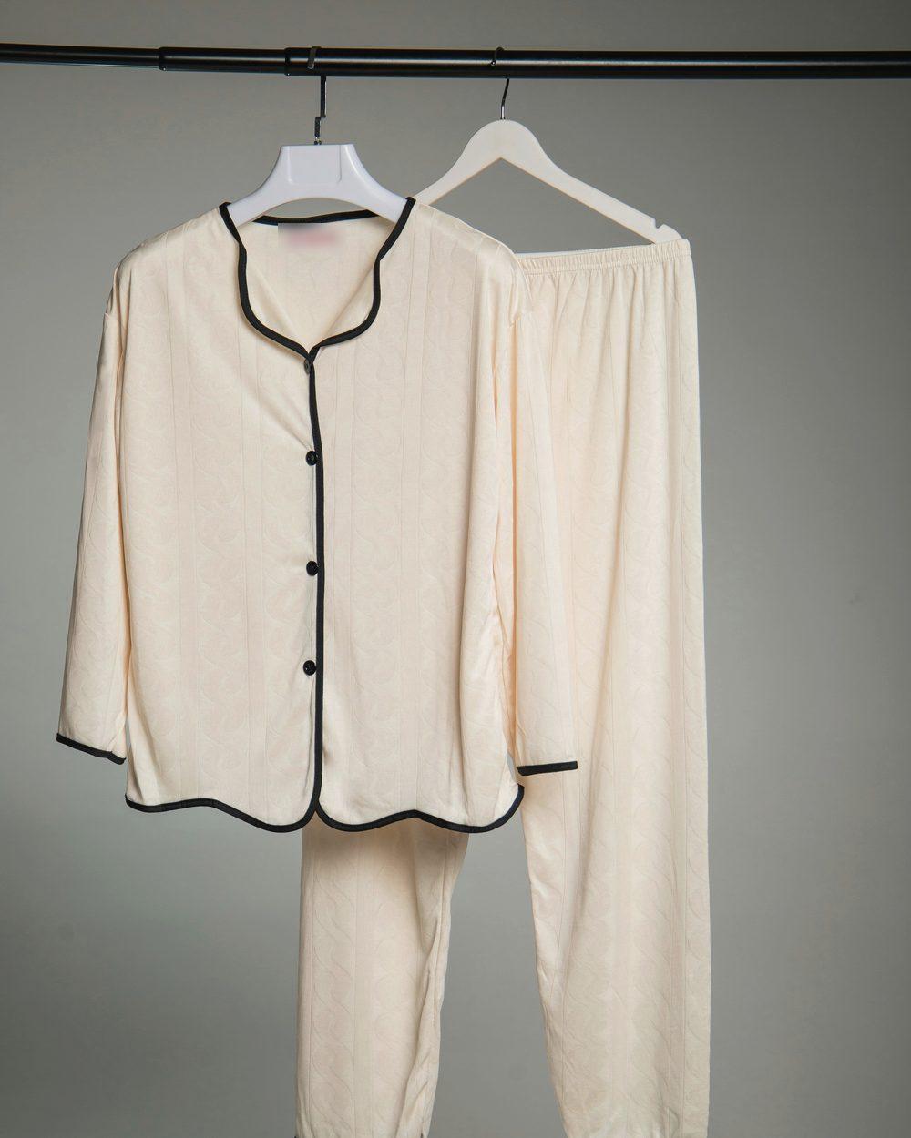 Cream pajama set on hangers